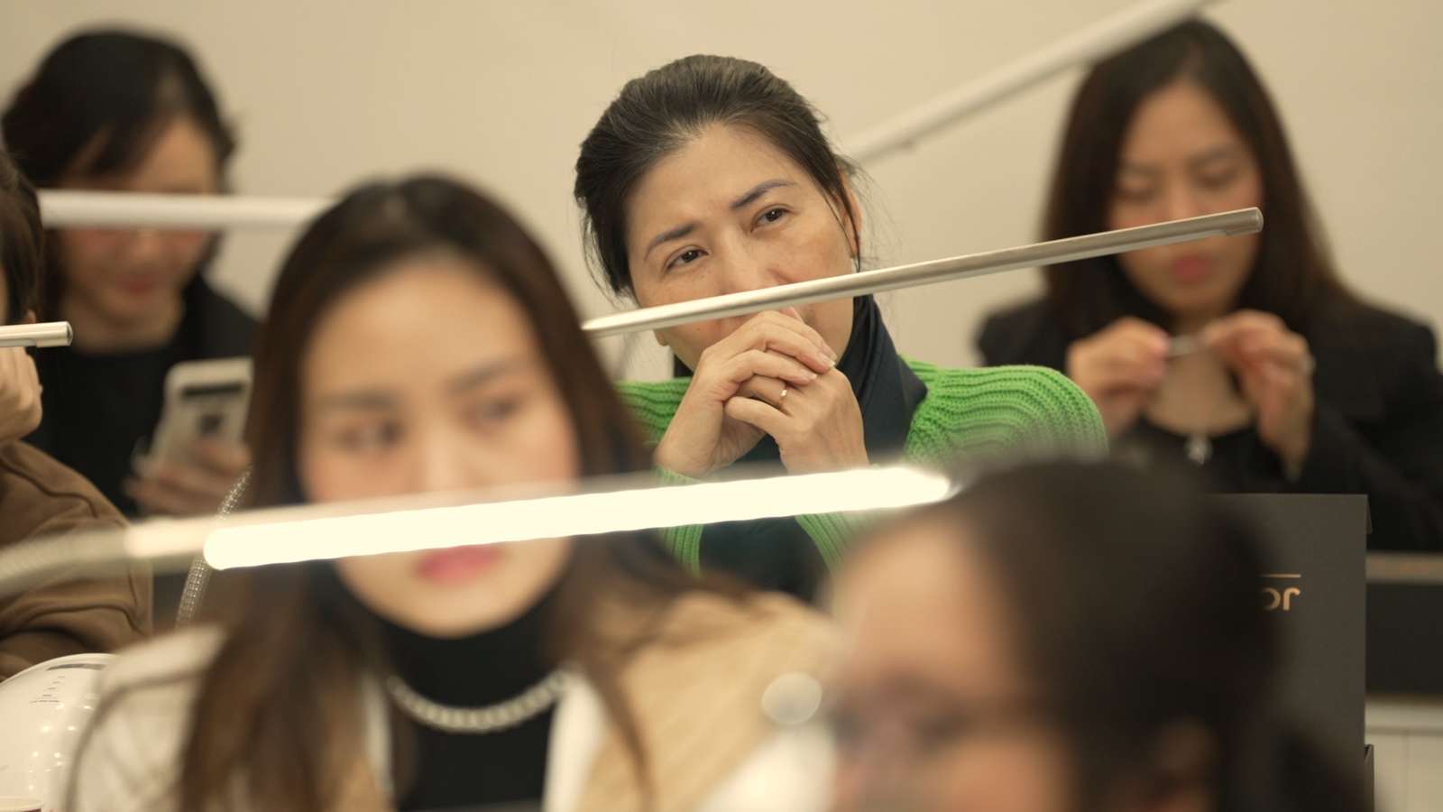 Students smiling and listening during a JDP ACBNT training session